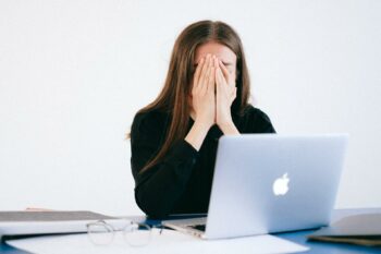 Woman looking sad after experiencing quiet firing