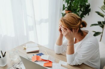 Woman checking receipts ready for a tax audit in 2023