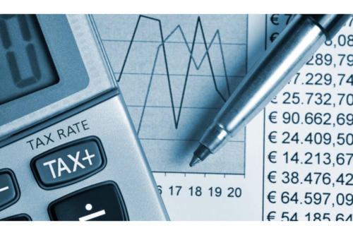 Calculator, pen, and financial chart with euro figures.