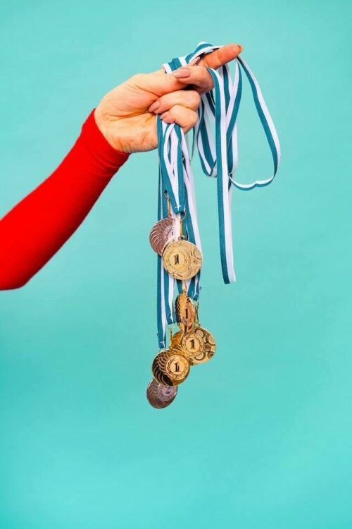 Person holding medals