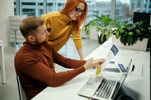 Co-founders at their desk after asking the question "what is a PSA agreement?"