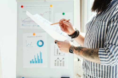 Person standing in front of a chart board