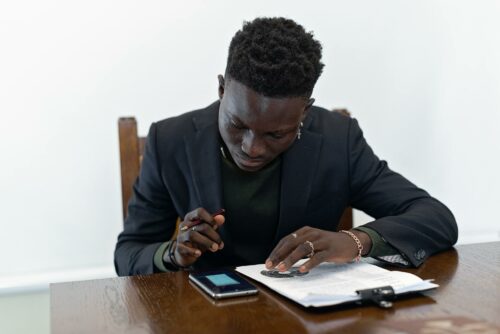 Man on phone looking up SME accounting services