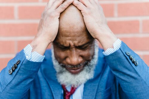 Man with beard stressed about business accounting services