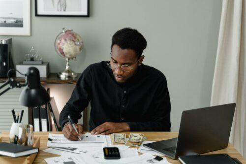 Man looking up tax credits repayment information
